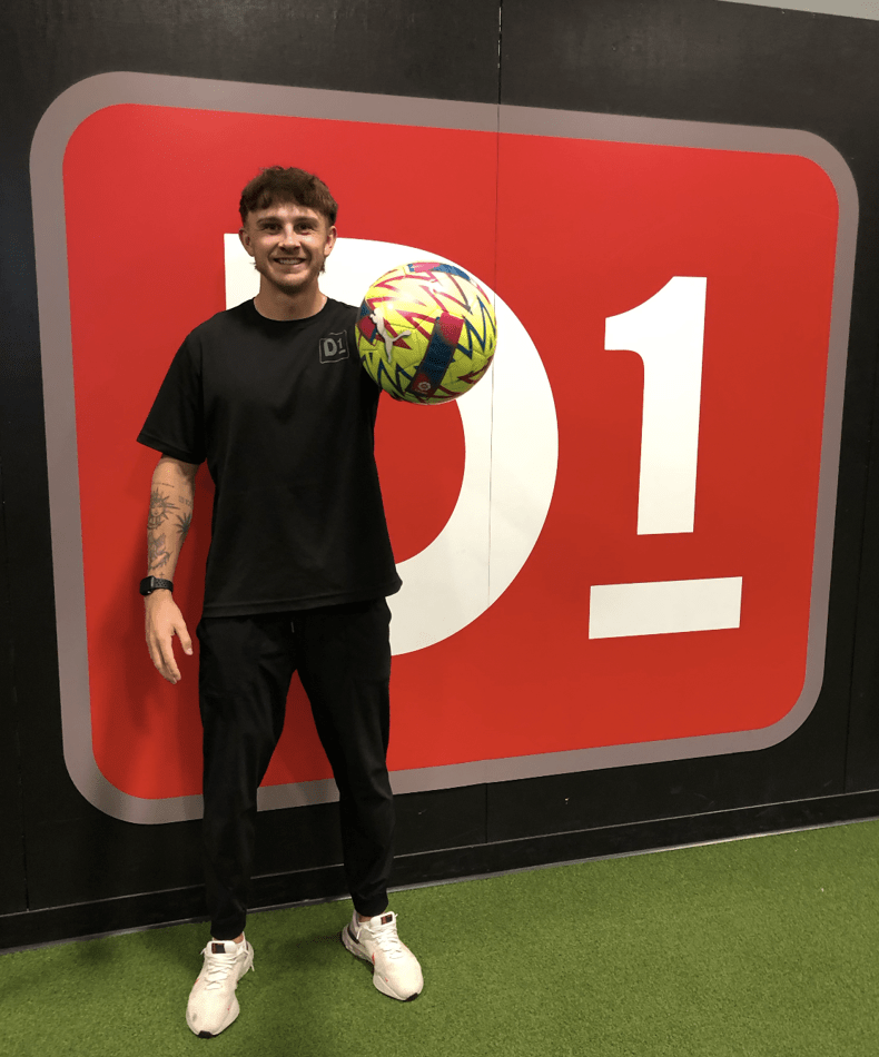 d1 training employee with soccer ball